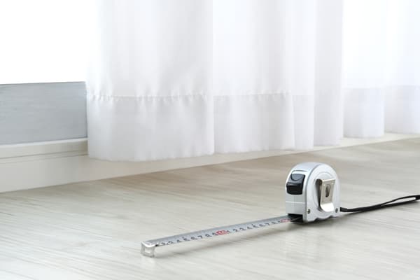 An extended tape measurer on the floor